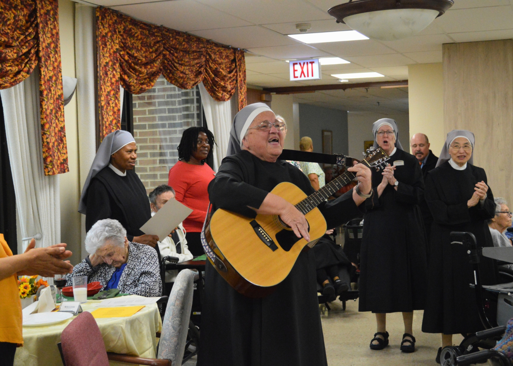 25th and 50th Jubilee Photos 2026 - Jubilee Small Dining Room Singing 1